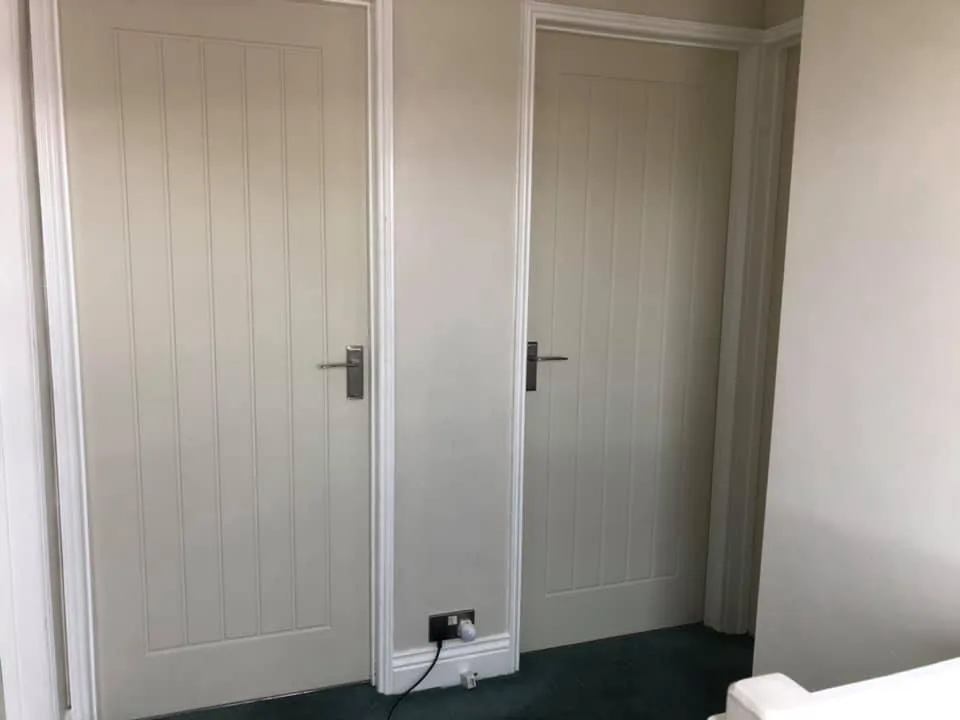 2 white wooden doors