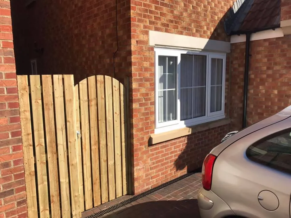 wooden gate next to house